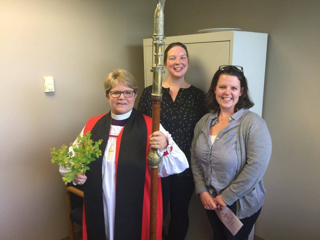 Bishop DeDe blesses the Communications office, with Director of Communications, Meredith Sanderson, and Temporary Director, Sarah Alamond. 