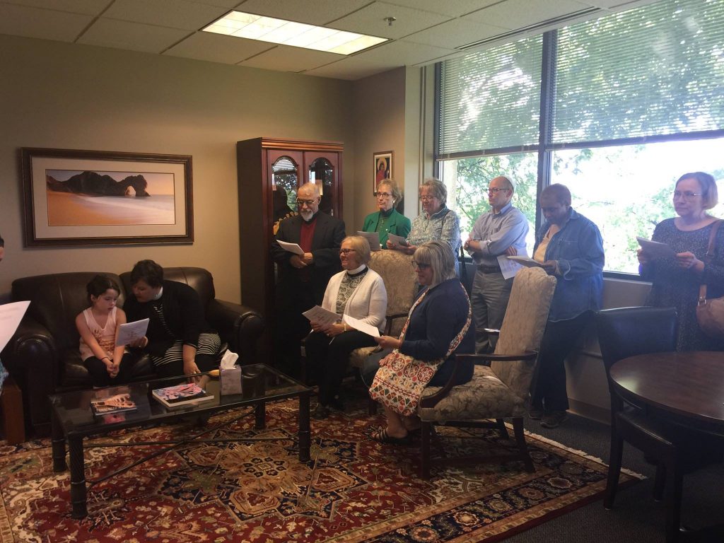 Guests gather in the Bishop's office for the blessing of her space. 