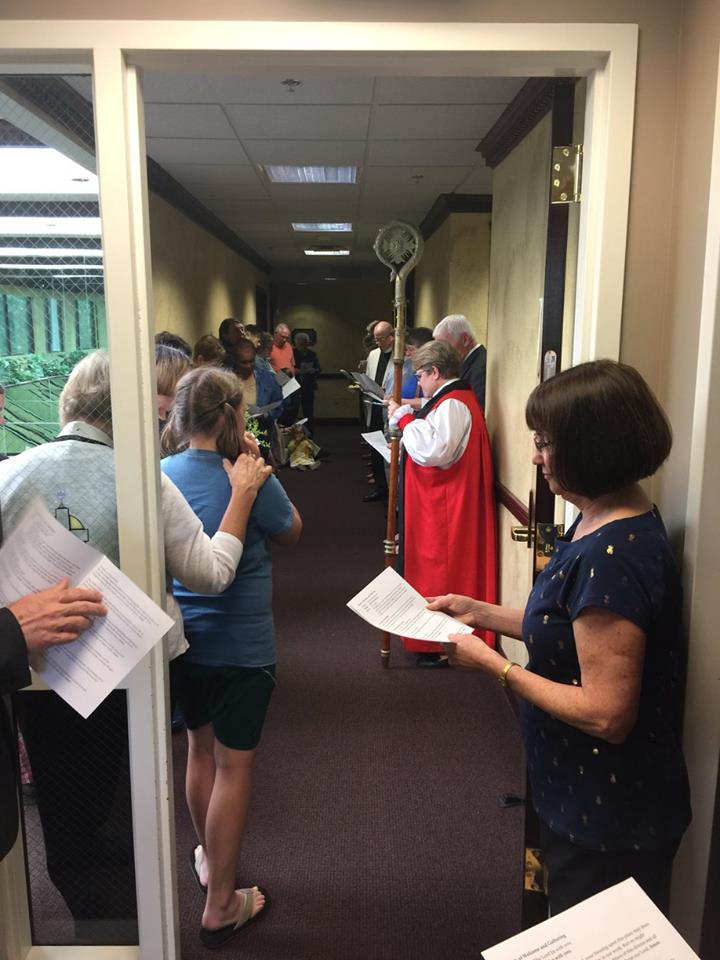 Guests gather to begin the blessing of the Diocesan Office space. 